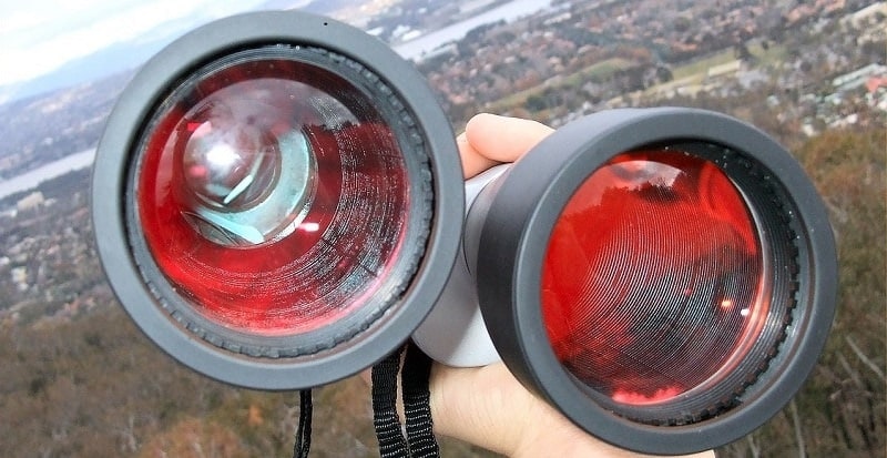 Objective lenses with ruby red coatings